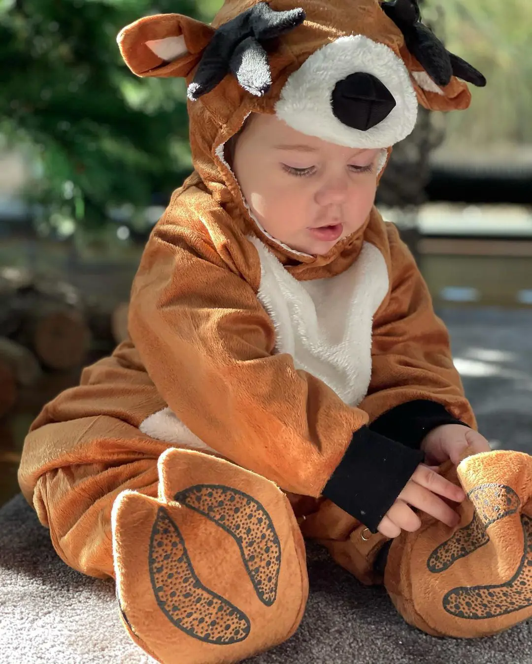 Candid photo of Benicio wearing a Reindeer custume.