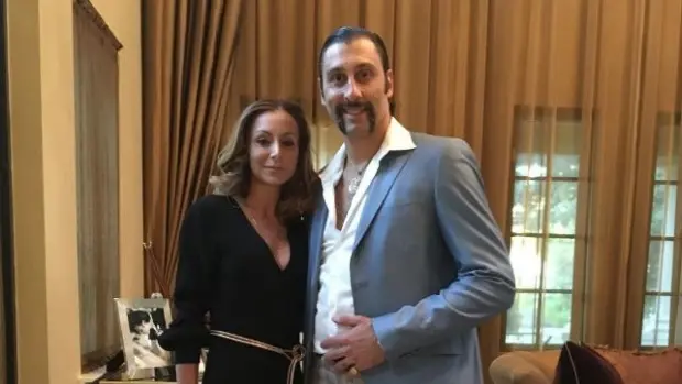 Roberto Luongo dressed up with his wife for a school fundraiser