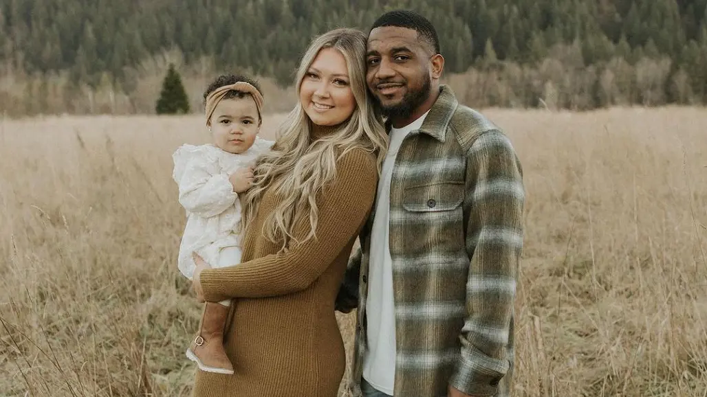 Quandre Diggs with Abby Evans with and their daughter Ariya