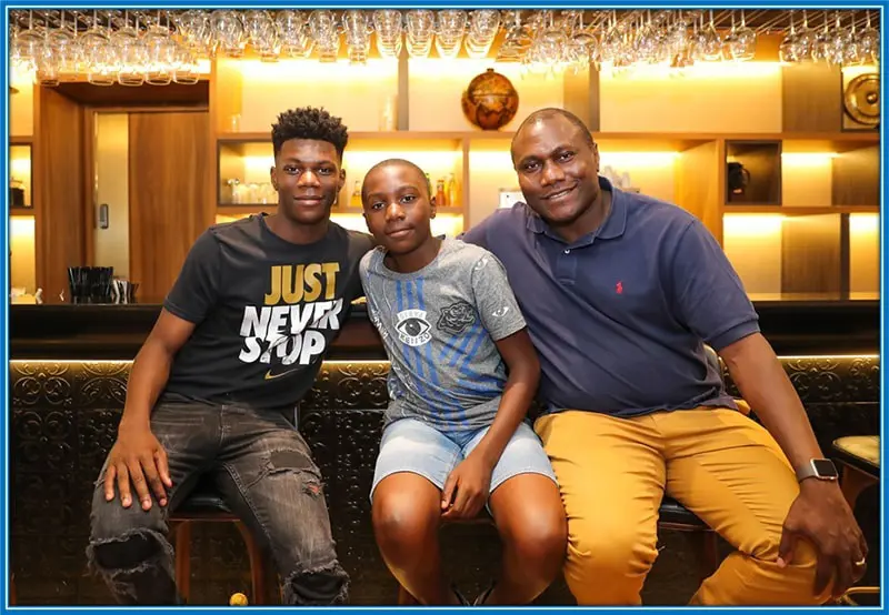 Aurelien with his father and brother.