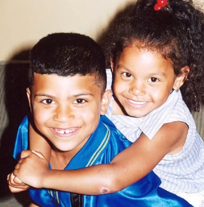 Childhood photo of Deandre with his sister Jenea 