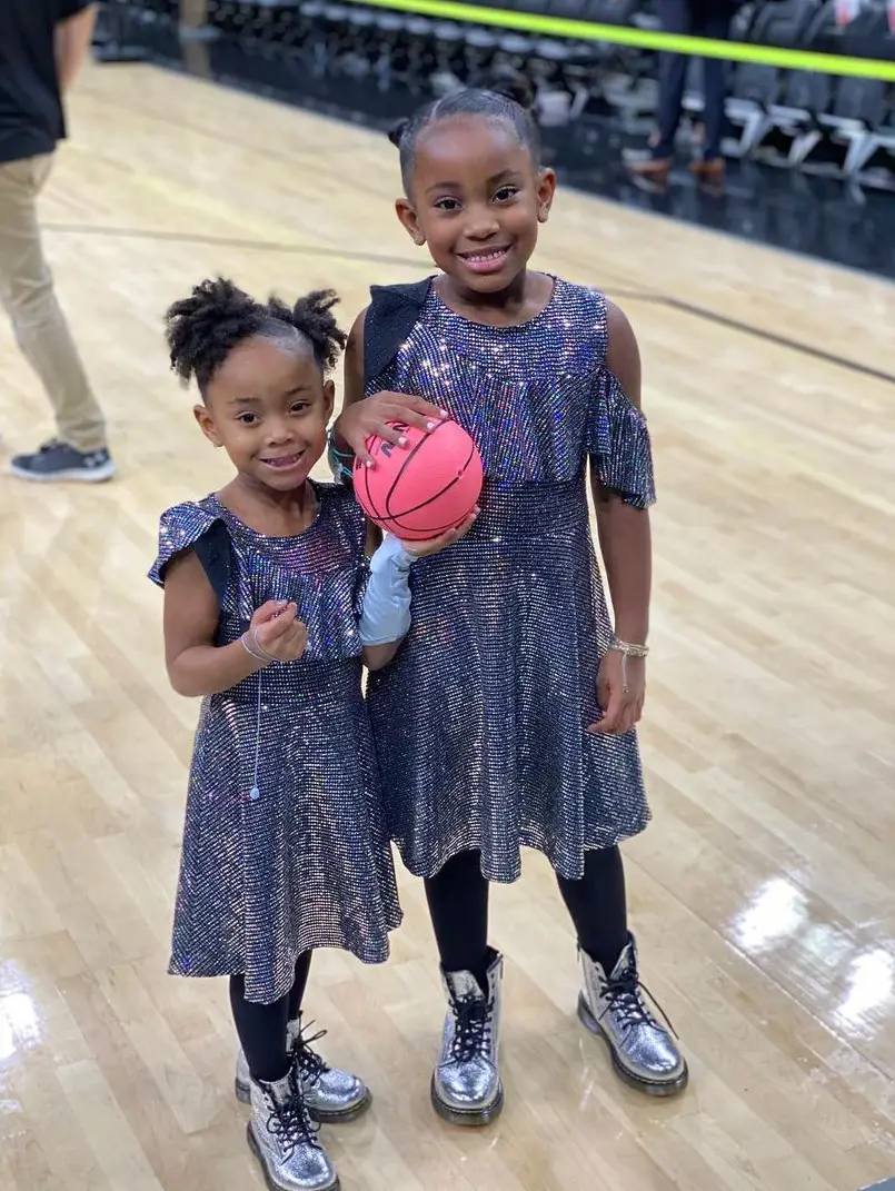 Demar and his lovely girls on a basketball court