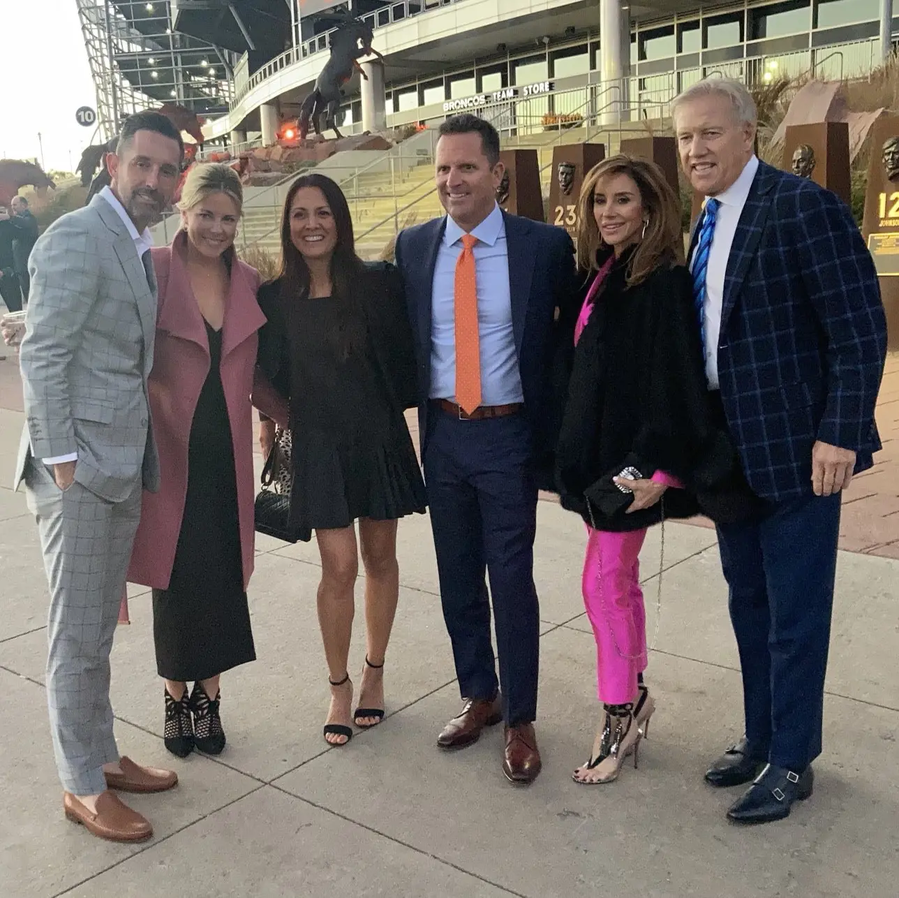 Kyle and Mandy (far left and second from left), respectively with George Paton, John Elway, and their partners at Mike Shanahan ROF ceremony in October 2021.