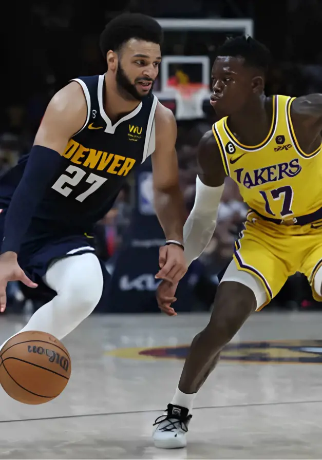 Jamal Murray(left) competing against Dennis Schroder for the ball.