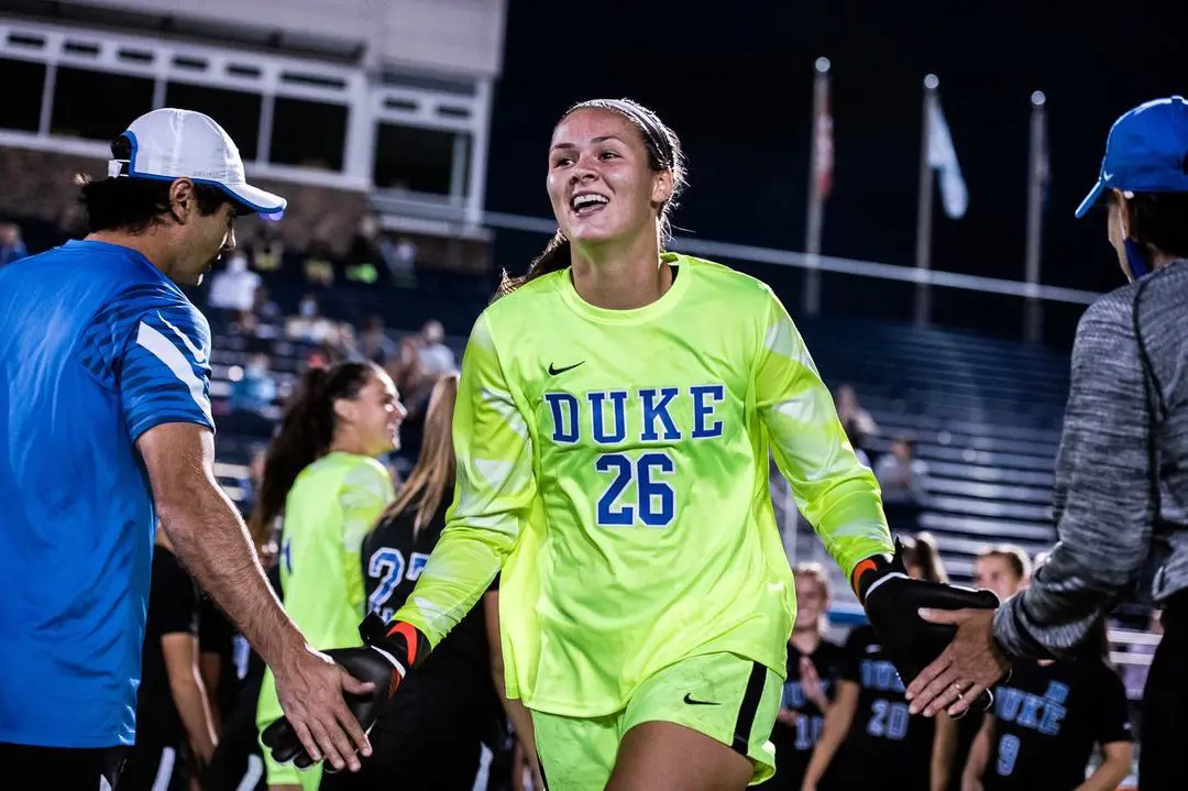 Ruthie Jones is cheered on by her the fans and her teammates as she comes out on the field for the final game of 2021 season 