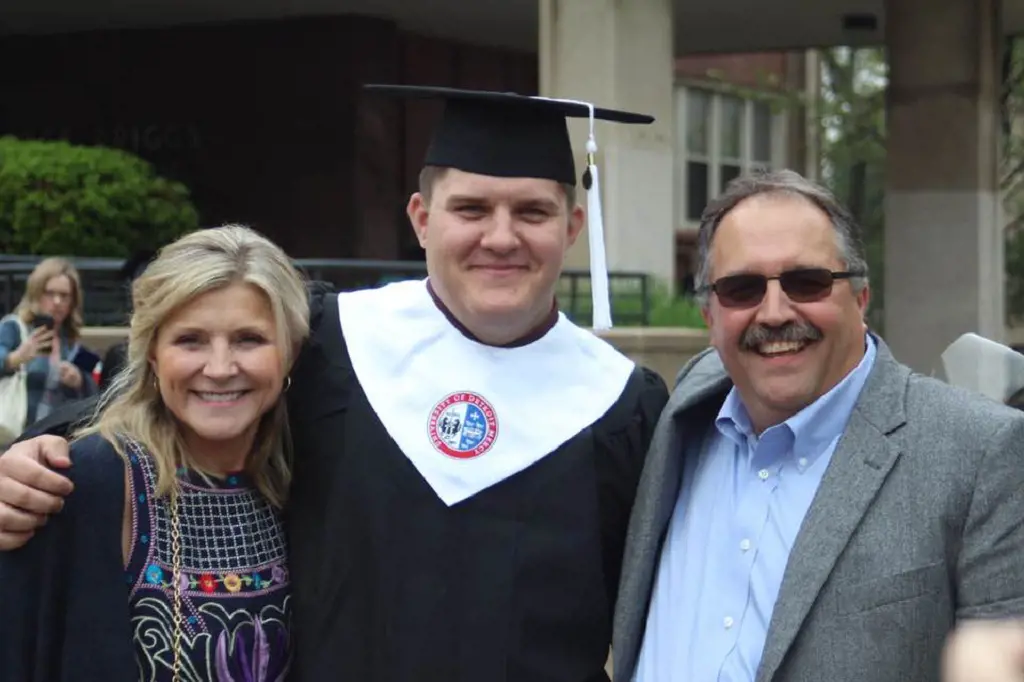 Michael with Stan and Kim during his graduation ceremony in 2018. 