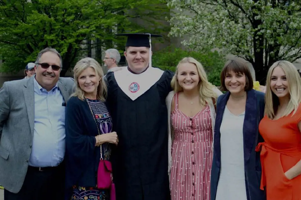 Stan and Kim attending Michael graduation ceremony in 2018. 