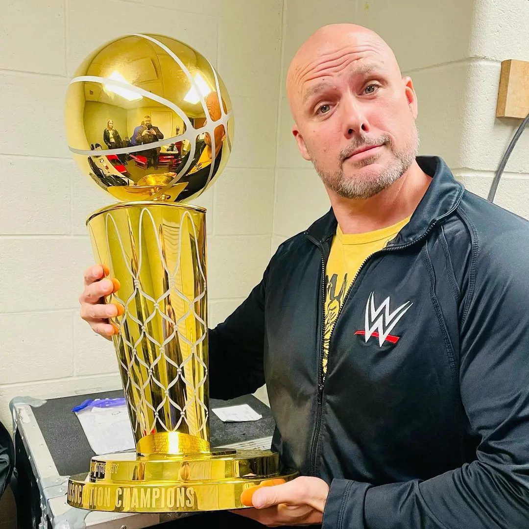 Adam Pearce with 2023 NBA trophy 