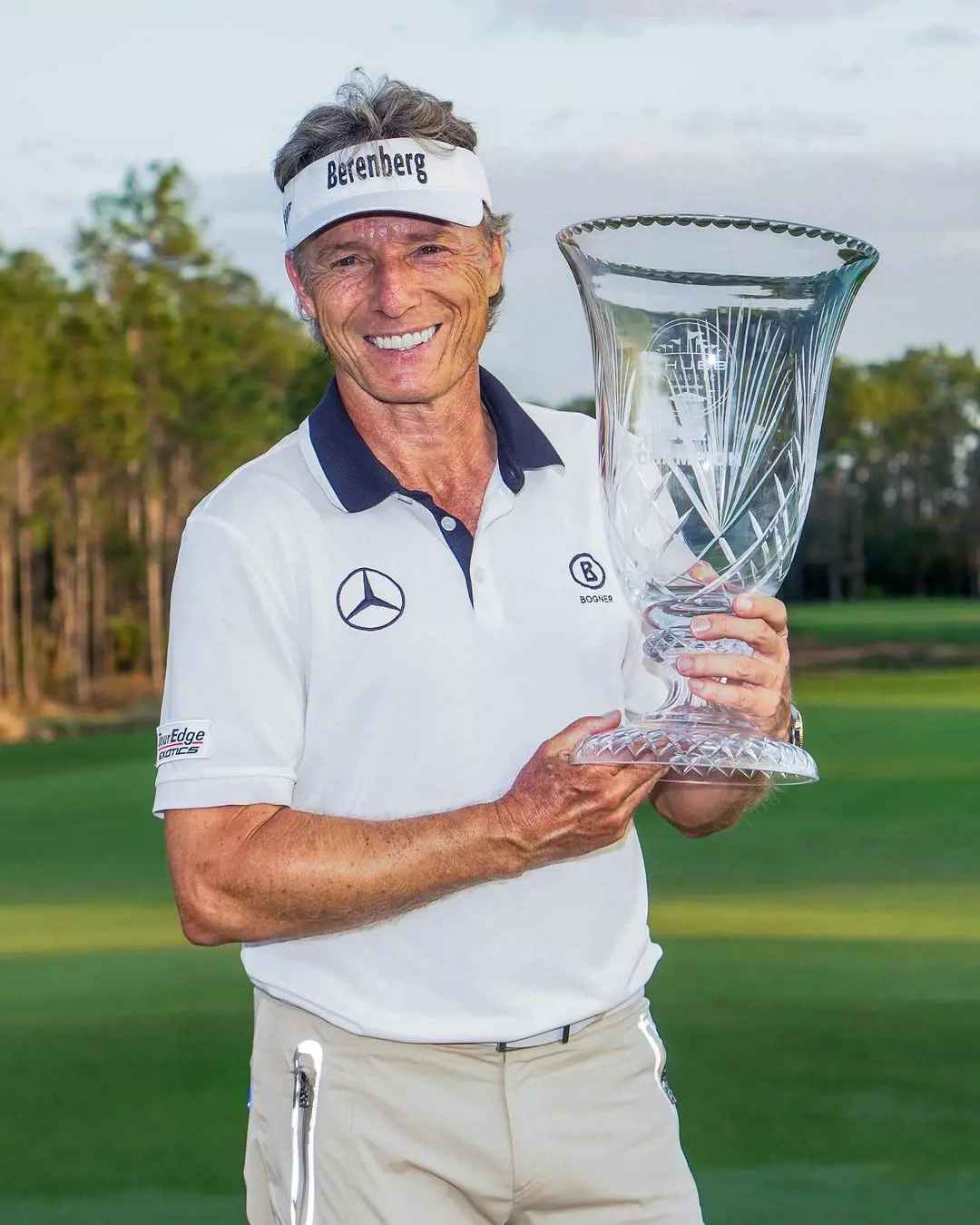 Bernhard Langer celebrating after wining 2022 PGA trophy at Tiburon golf club