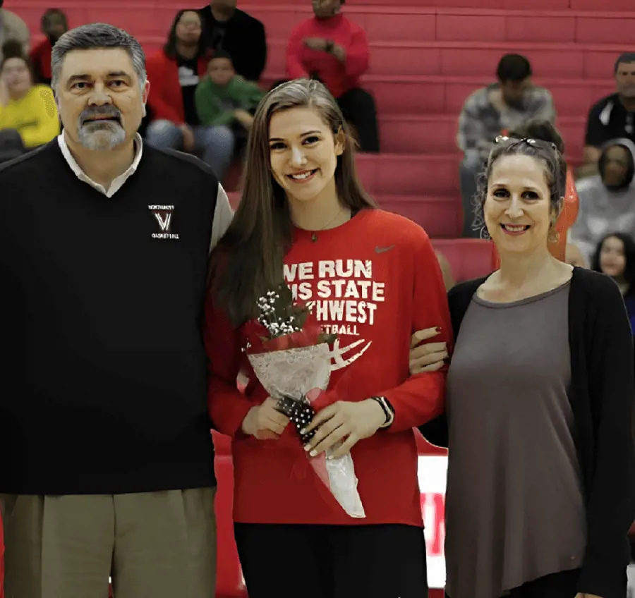 Elizabeth celebrated her Senior Night with Ralph and Loretta.