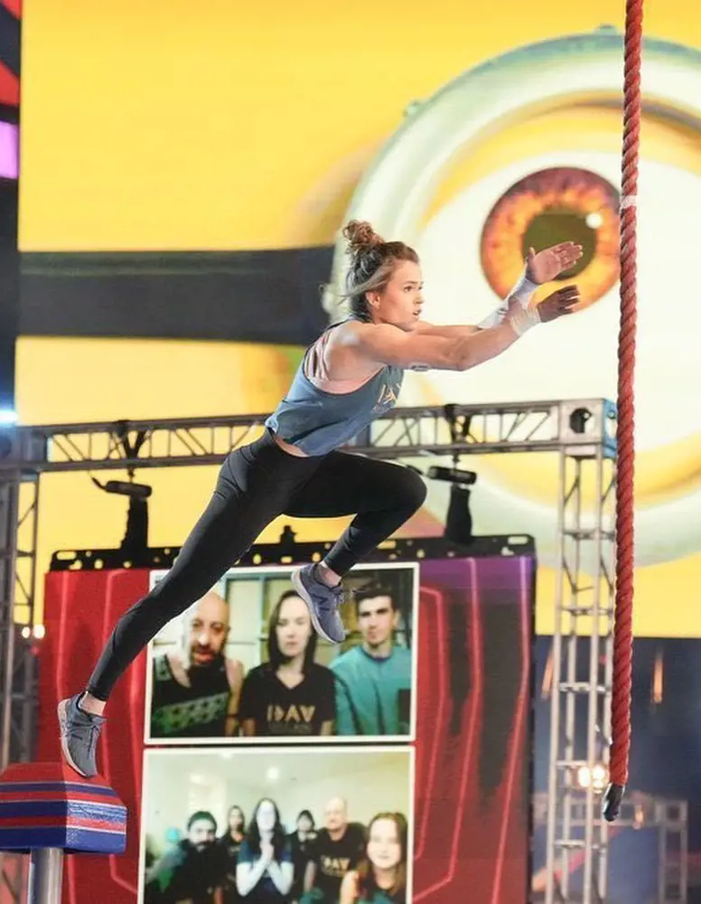 Katie Bone jumps to catch a rope during the show in June 2022.