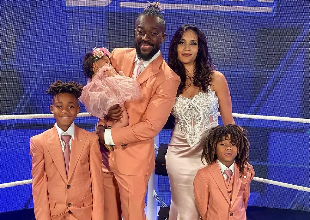 Kofi with Kori, Khi, Orion and Lotus attending WWE Hall of Fame event at the American Airlines Center in Dallas, Texas in April 2022