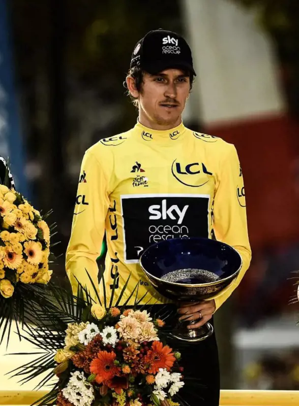 Geraint Thomas holds the trophy after his 2018 triumph.