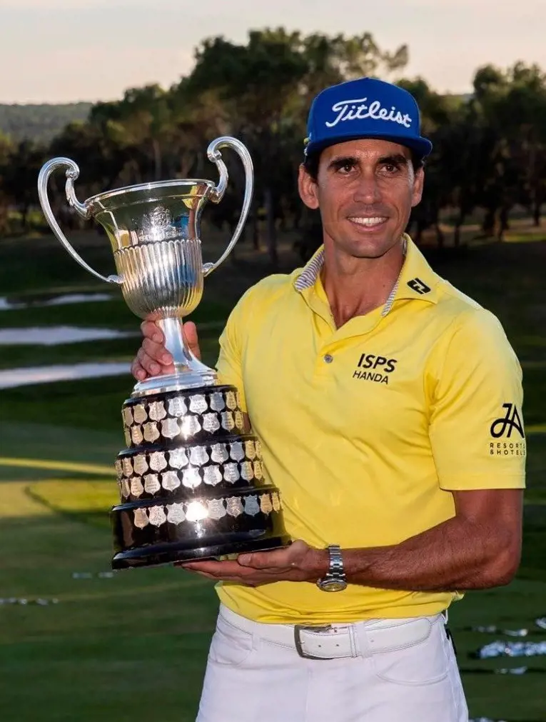 Rafael Cabrera-Bello holds the 2021 Acciona Open Trophy