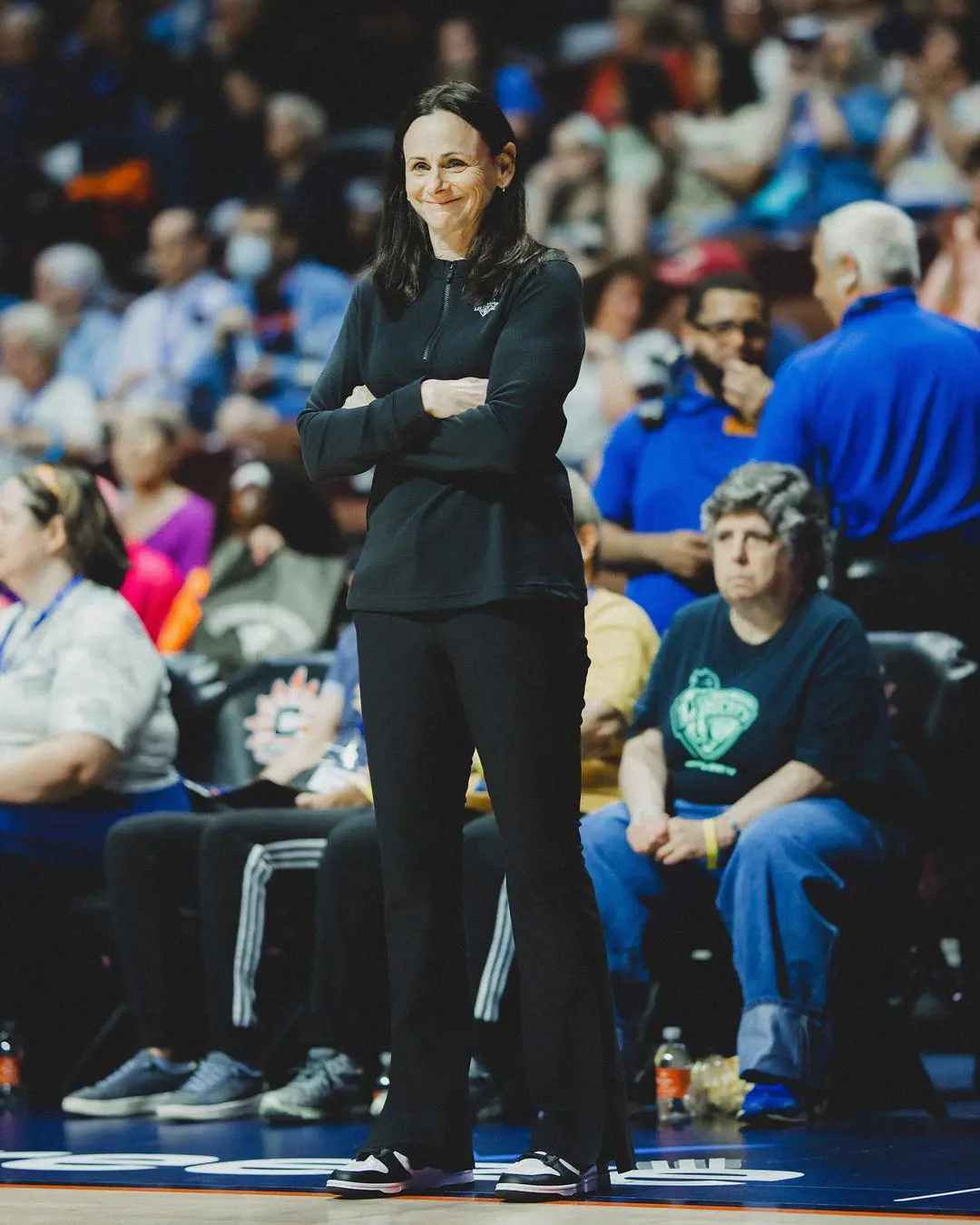 Sandy Brondello smiles before a WNBA game in June 2023