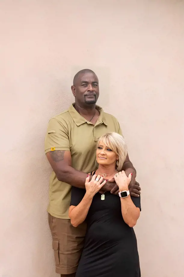 The 6 feet 7 inches giant poses with his beautiful wife Debbie Cunningham