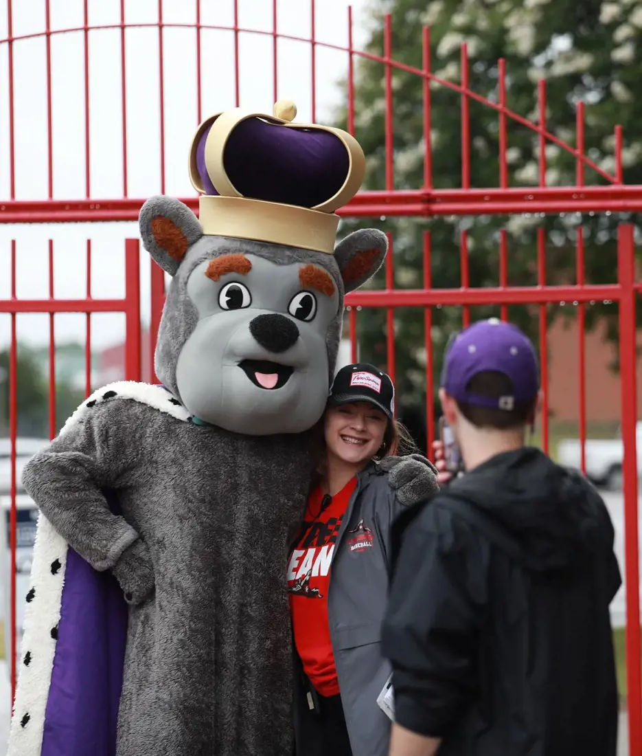 Fans taking picture with one of the Richmond Flying Squirrels mascot before the game 