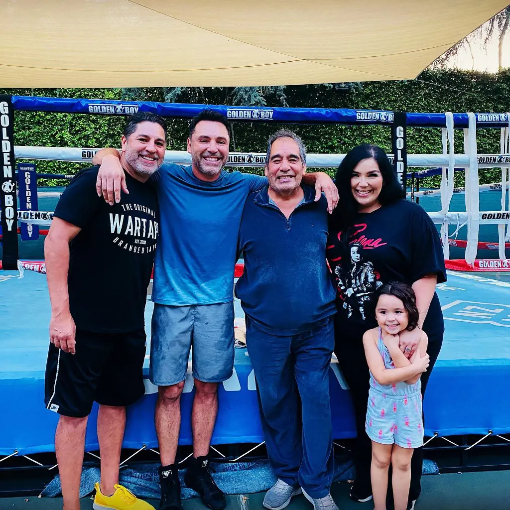 Joel Jr, Oscar, Joel Sr. and Ceci with Luna at the Golden Boy camp in 2021.