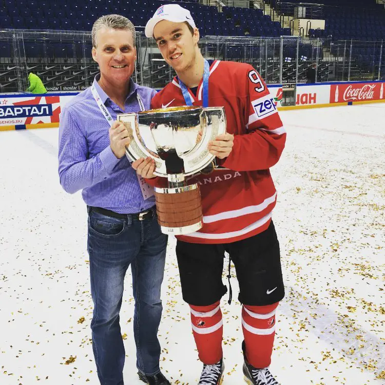 Connor holding his championship with his dad in Moscow, Russia, on May 23, 2016