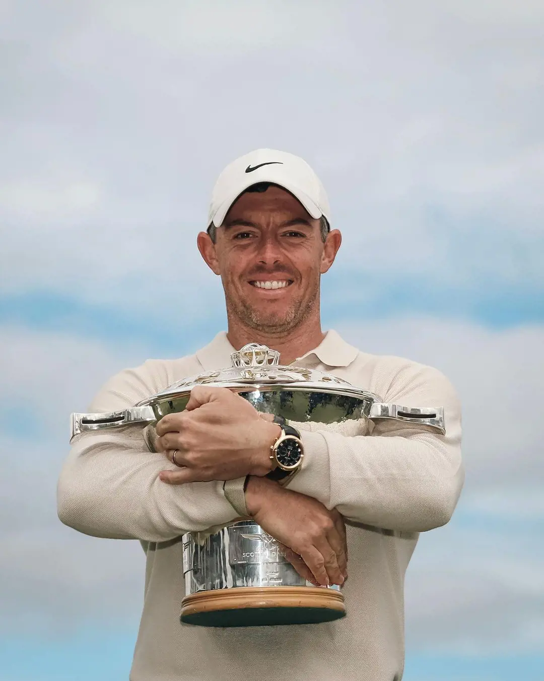 July 2023, Scottish Open winner Rory celebrating while holding the trophy in his hand