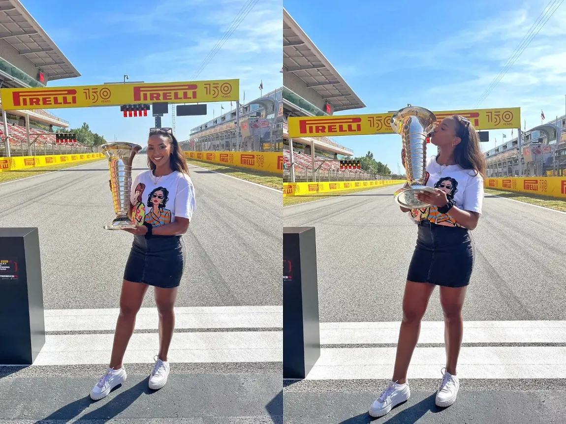 Naomi Schiff holds and kisses the coveted Formula One Championship trophy in Barcelona in May 2022