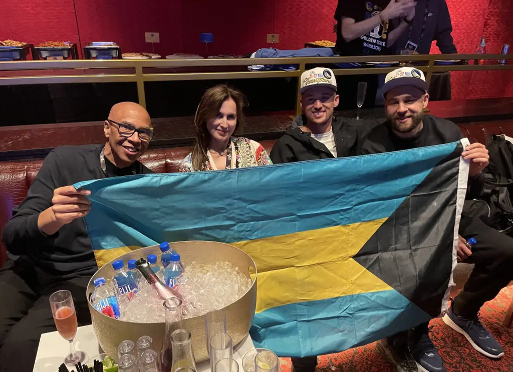 The Thompson clan waves Bahamian flag in June 2022