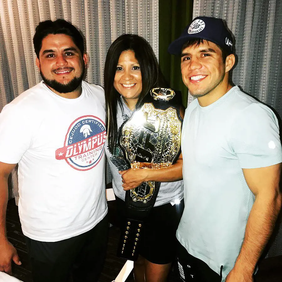 Henry (R) with Angel (L) after he wins the Olympus UFC Champion in August 2018