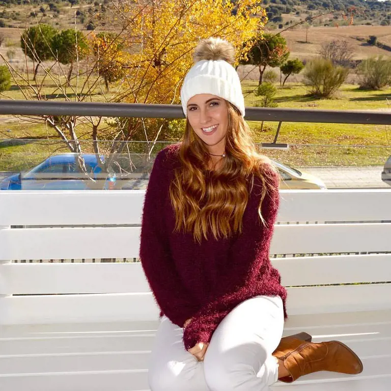 Claudia looking lovely in purple sweater, white pant and boot. 