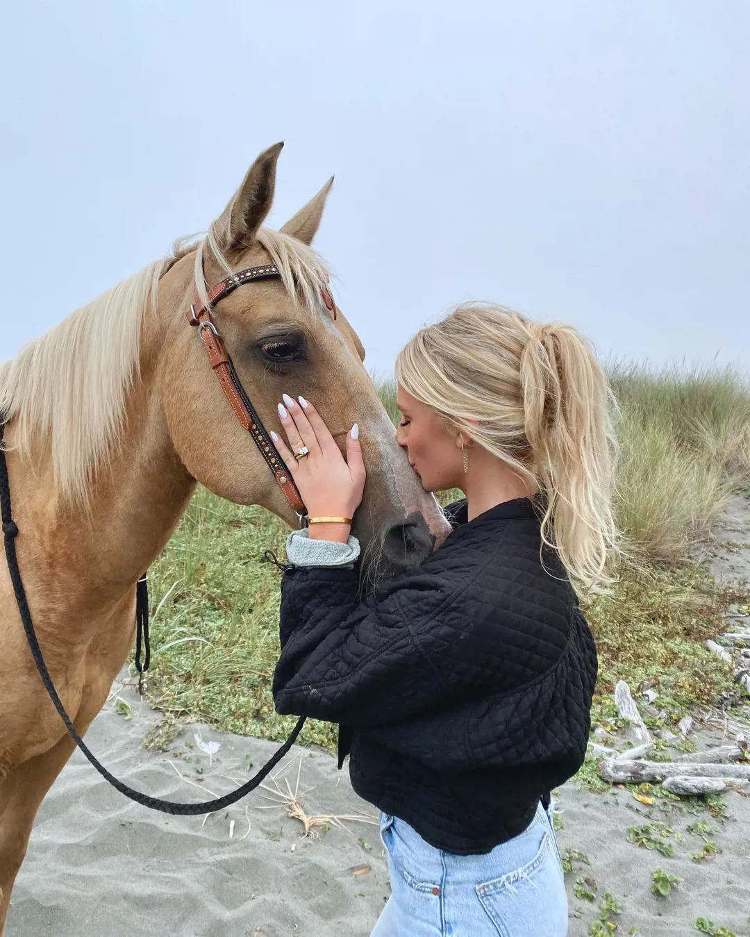 Kara kissing her horse Barbie in Humboldt County in August 2021