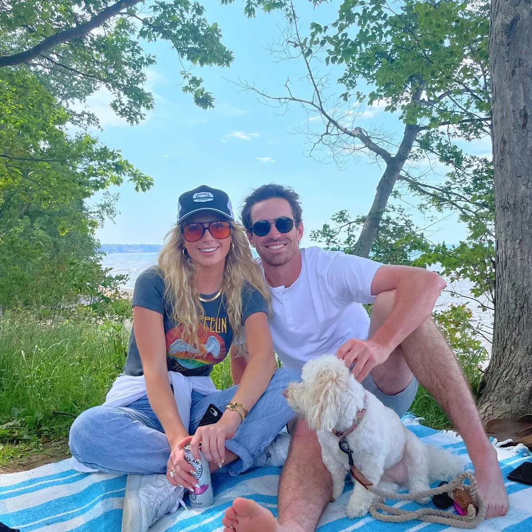 Shane with Kara and their pet dog enjoying summer in Westlake, Ohio in June 2021