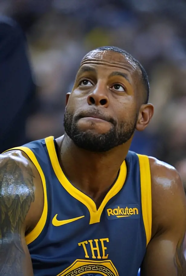 Andre Iguodala sits on a bench for a game vs Oklahoma in November 2018