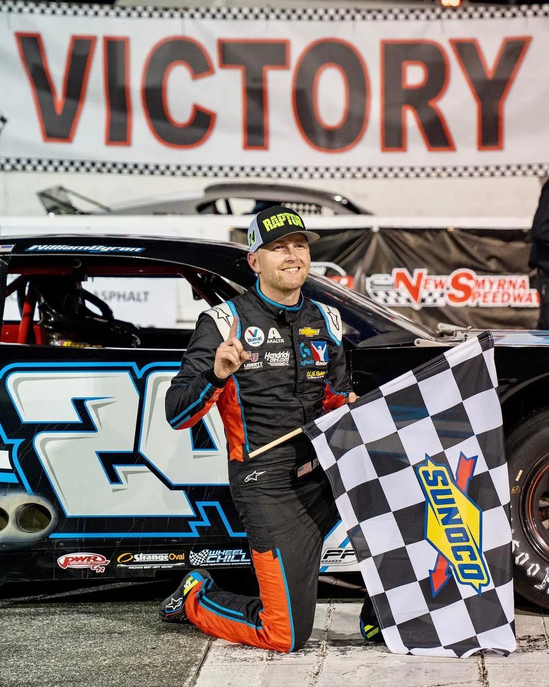 William during his race holding the flag on February 14, 2023. 