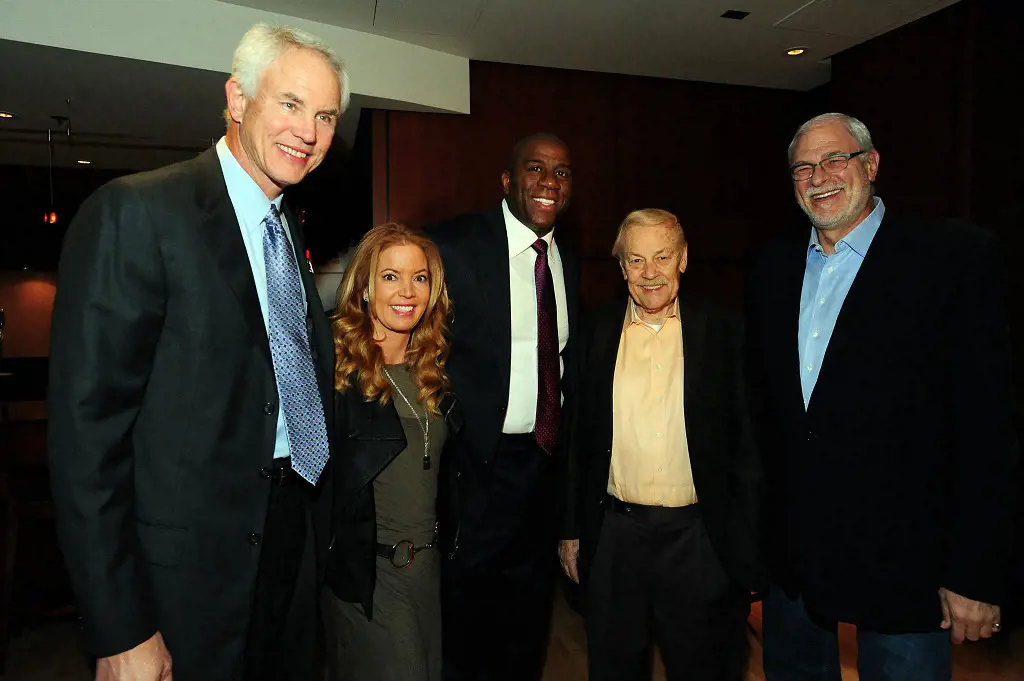 Mitch Kupchak, Jeanie Buss, Magic Johnson, Jerry Buss and Phil Jackson posing at the Magic Johnson Foundation Press Briefing in November 2011