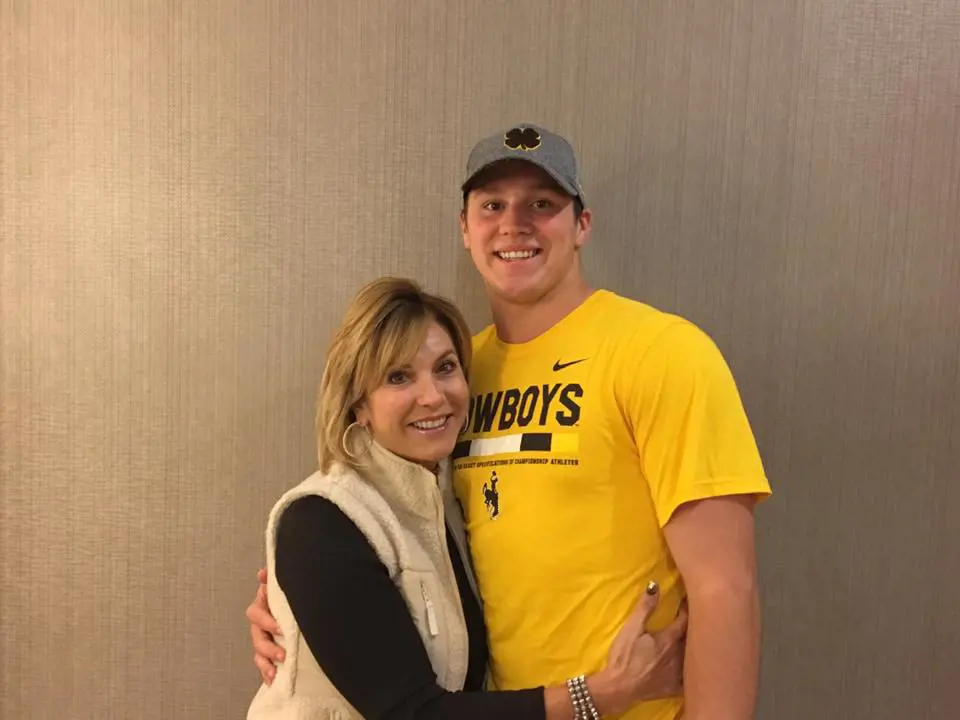 Lavonne embraces her son, Josh, on a day out at a game in support of Wyoming in 2017