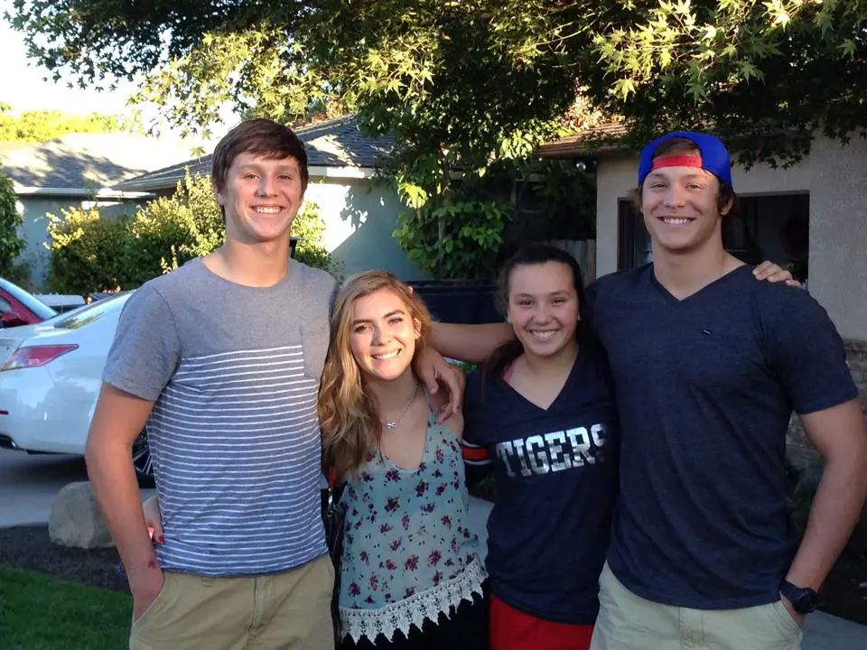 Jason, Nicala, Makenna, and Josh in their yard in Fresno, California, USA on October 6, 2014