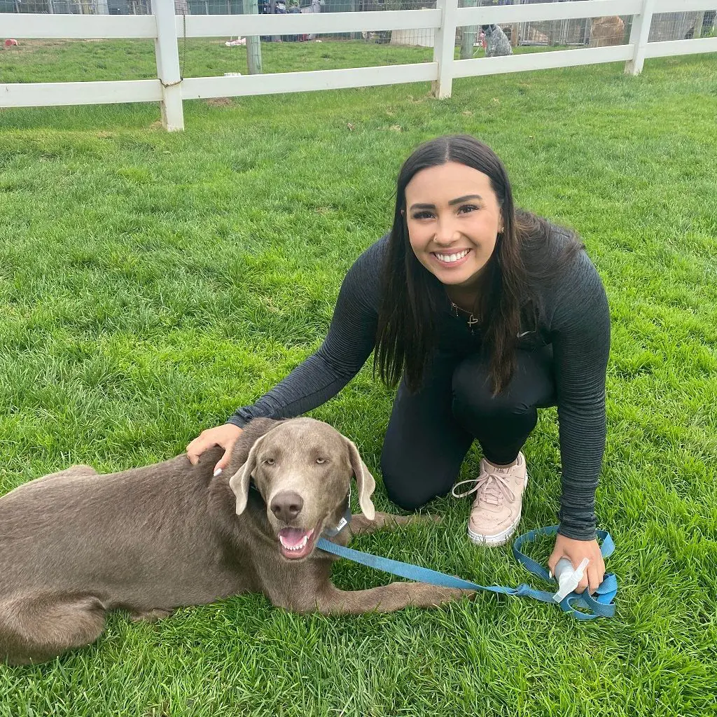 Makenna walks her pooch around the premises of the animal shelter