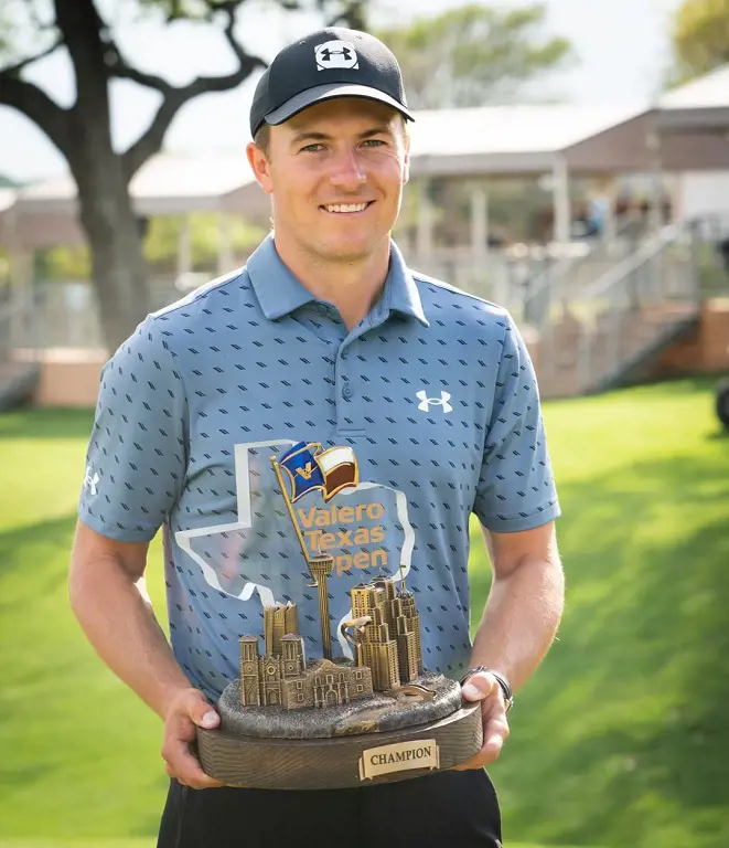 Jordan holding Valero Texas Open champiosnhip trophy on April 6, 2021.