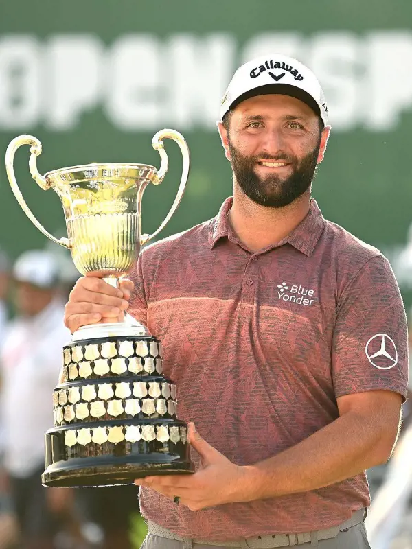 John Rahm holding Acciona trophy on October 10, 2022. 