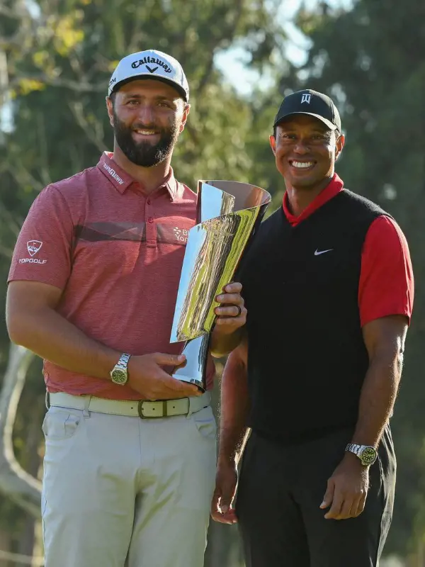 Tiger(right) with John Rahm as John won Genesis Invitational trophy. 