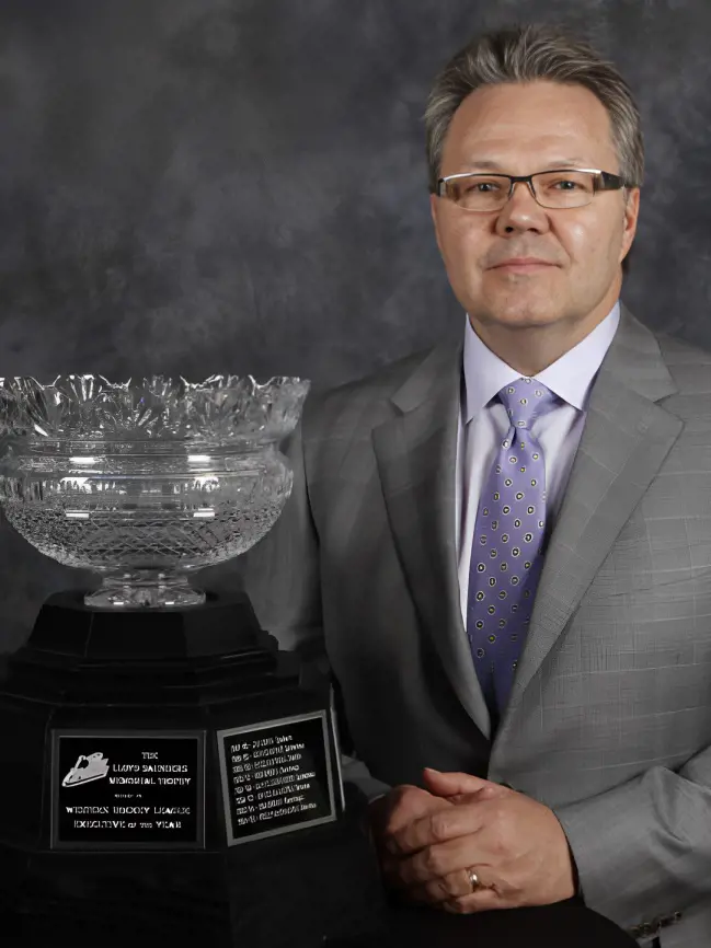 Kelly McCrimmon pictured infront of the Lloyd Saunders Memorial Trophy.