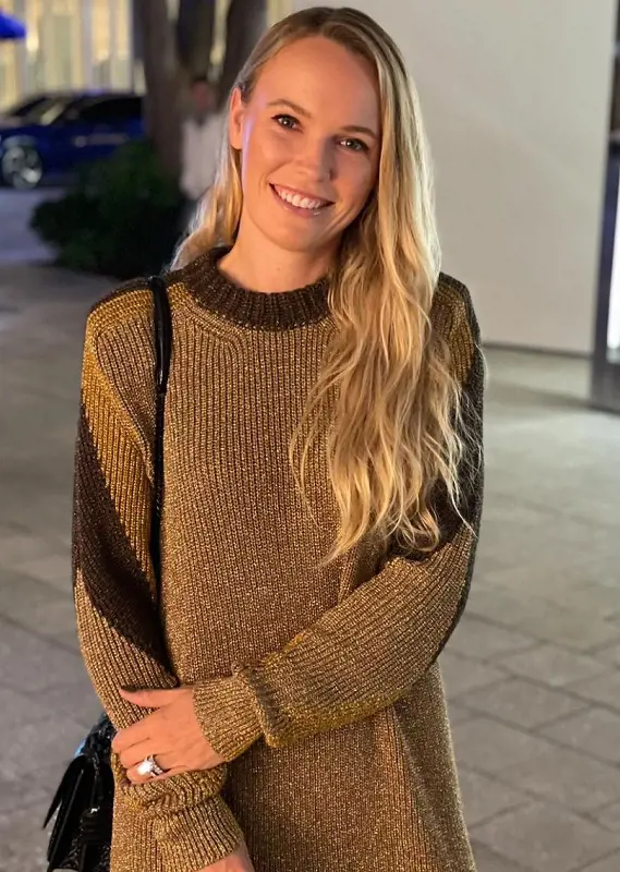 Caroline Wozniacki wears a beautiful brown sweater as a dress.