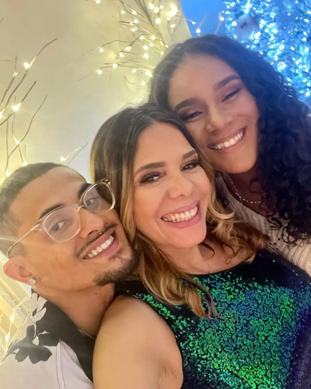 Joshua's (left) with his mother and sister during the 2022 Christmas party.