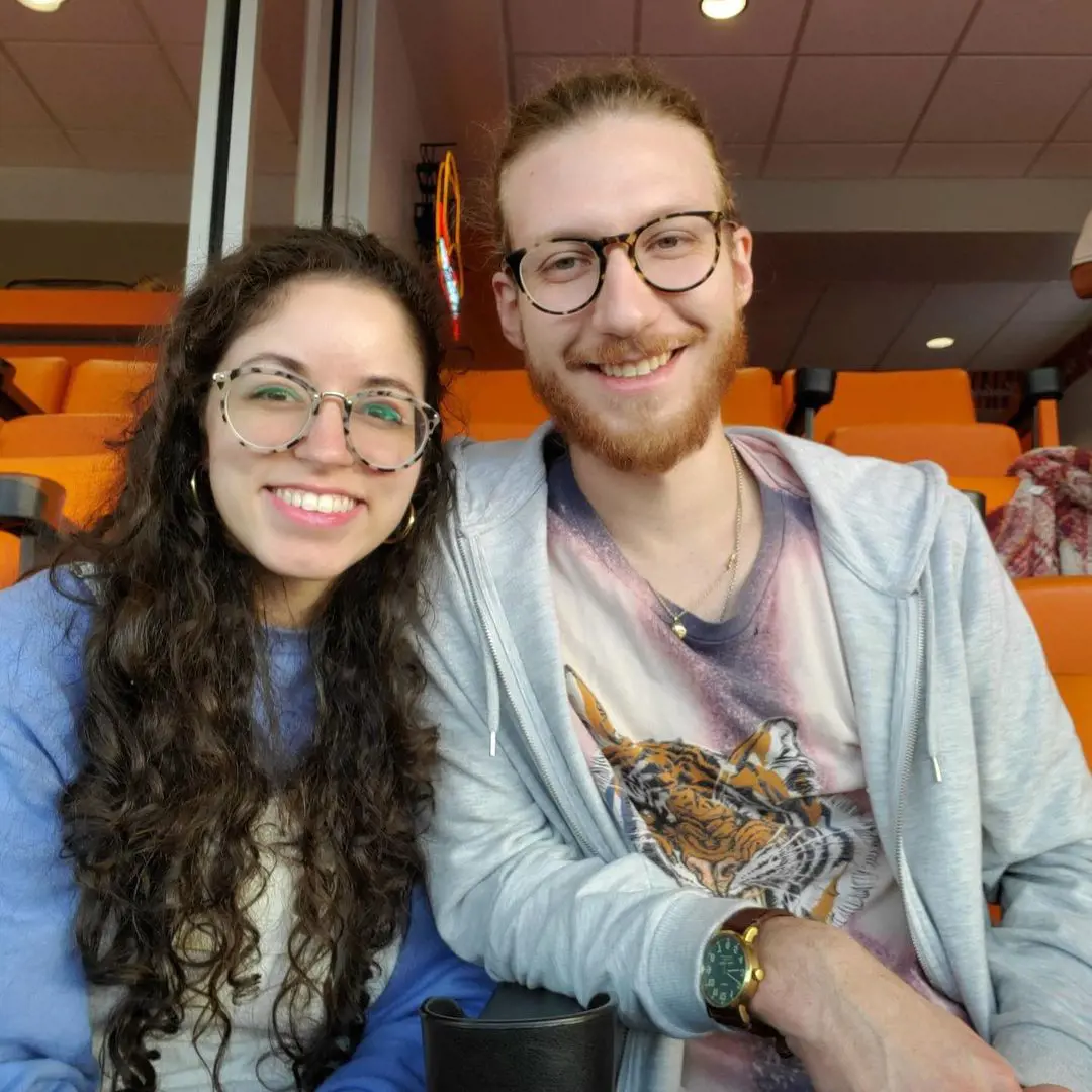 Chase and his wife, Brooke, flaunting their printed specs while attending a match in the stadium 