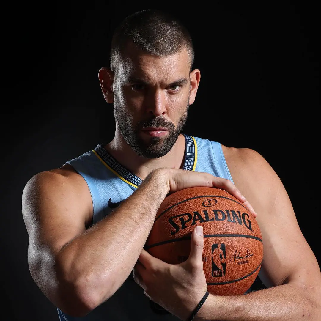 Marc striking a pose while clutching Spalding basketball in September 2018