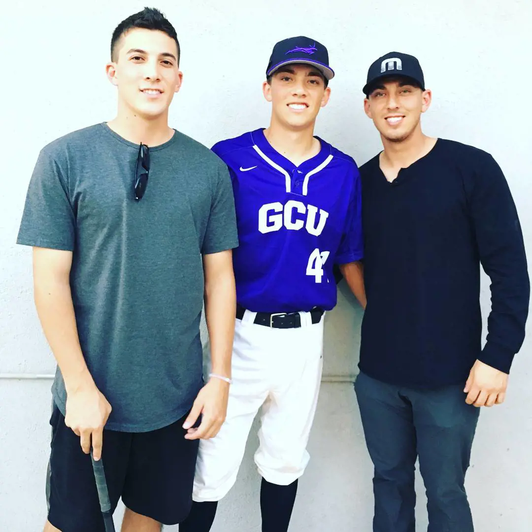 Austin congratulates Griffin after he joined Grand Canyon University baseball team in February 2016