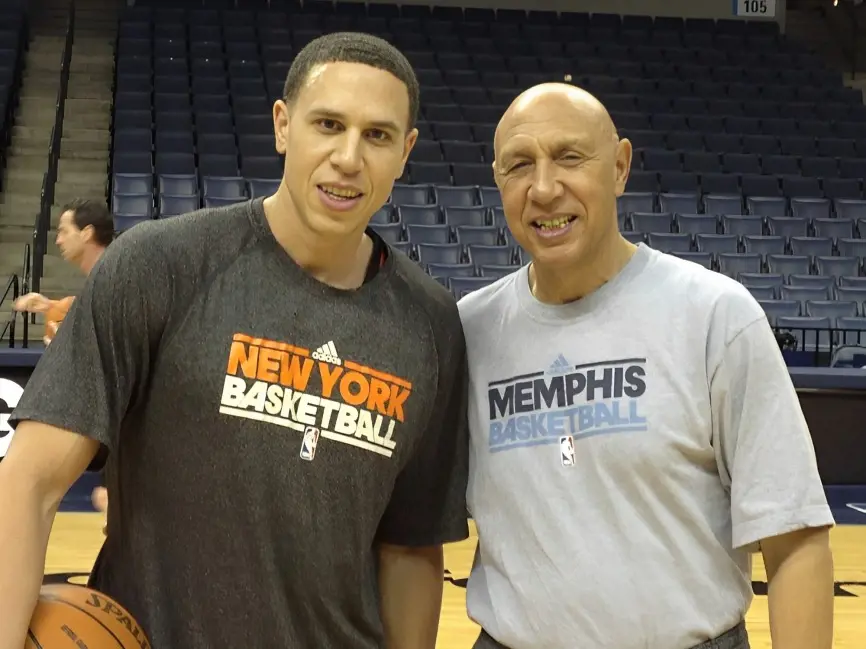 Henry Bibby (right) poses for a picture with his son Mike, who is also a National champion