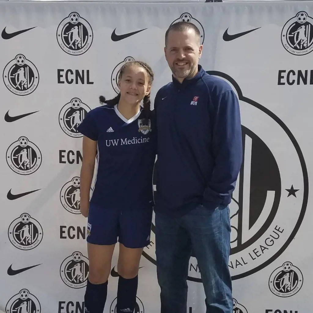 Mia wearing soccer dress and her dad Mario attending her games. 