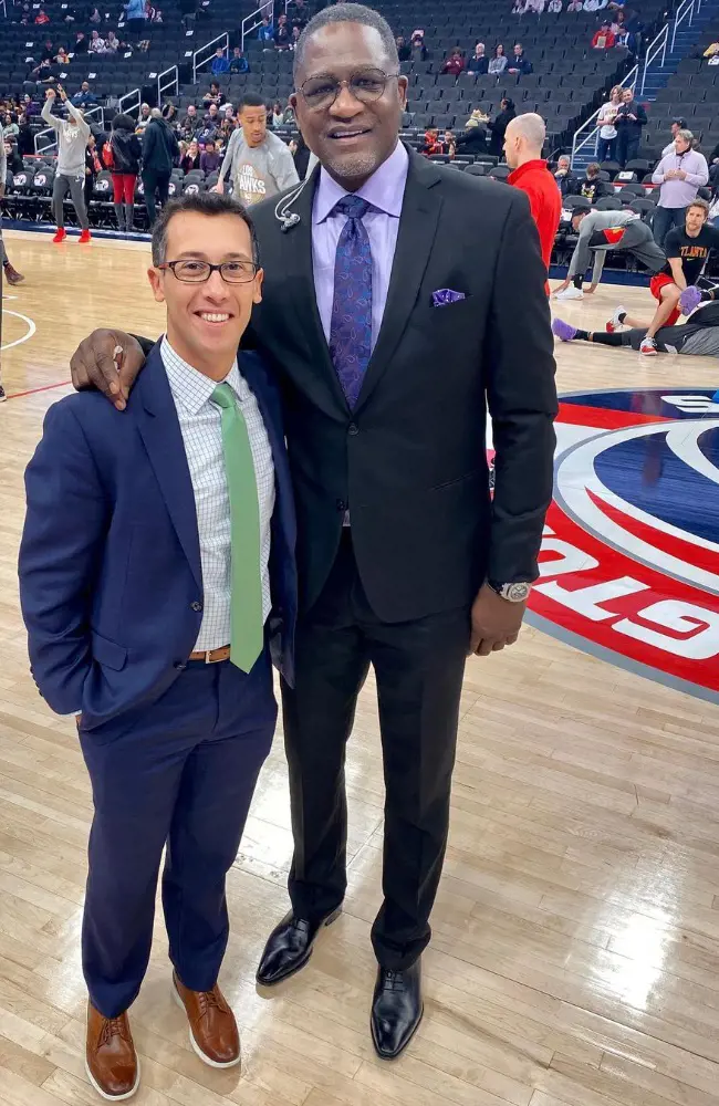 Justin with the basketball player Dominique Wilkins at Capital One Arena on March 7,2020. 