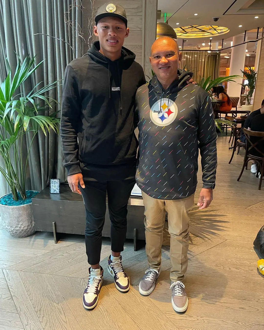 Joshua with his father at Aria Resort & Casino.