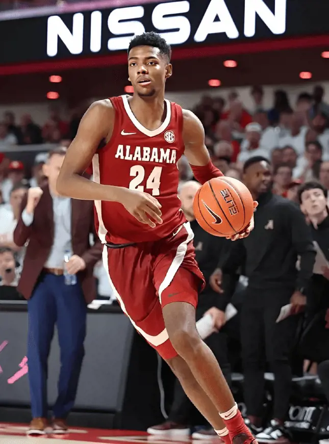 Alabama's SF Miller dribbling during an NCAA game in December 2022